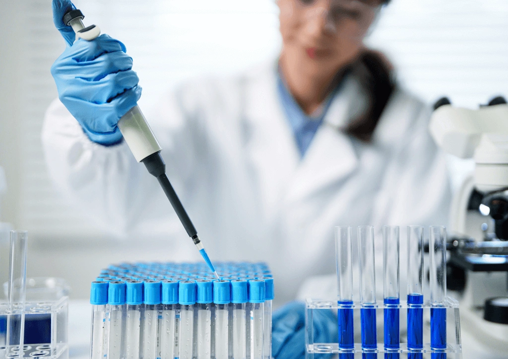 GbDx NAAT testing scientist using pipette