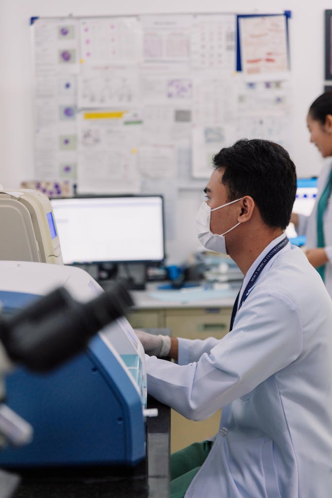 Laboratory technicians working on a medical analysis in a modern lab.